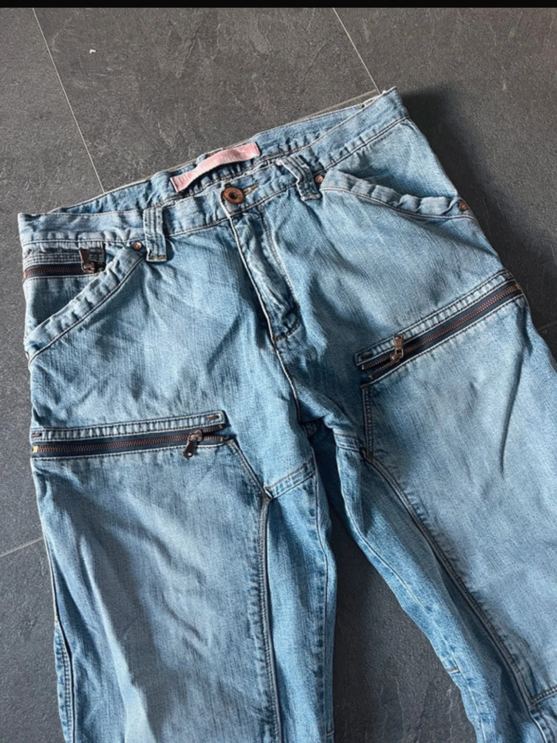 Ljusblå jeans med dragkedjor - 1