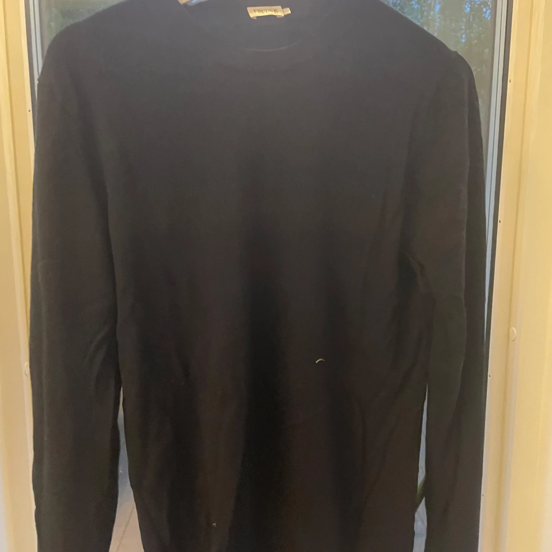 Svart långärmad stickad tröja