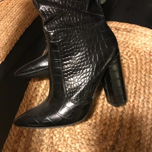 High heels boots  - It’s a nice item for party wear, heels are about 10cm and they are in a fair condition but a little scratch on the shoe tip as you can see in the last photo. 