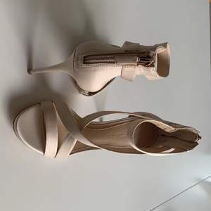 Light beige Satin stiletto heels by Imagine VINCE CAMUTO. Excellent condition, worn once.