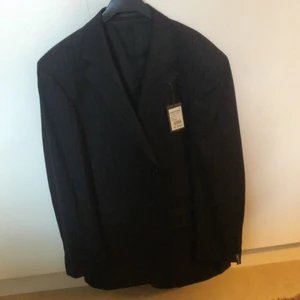 Helt oanvänd dressman kavaj i storlek 50 - Kavaj i nyskick från dressman 