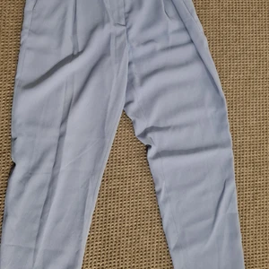 Kostymbyxor, storlek 38 - Blå kostymbyxor med knytning Storlek 38 Frakt tillkommer, 96kr