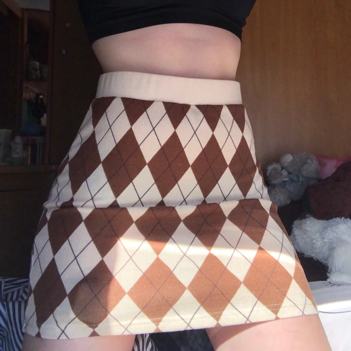 Minikjol, beige och brun i storlek S - M