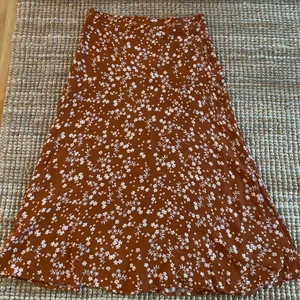 Long floral skirt.  - Long skirt super comfy for in the fall with a sweater. Has a small zipper on the side to open it up. 