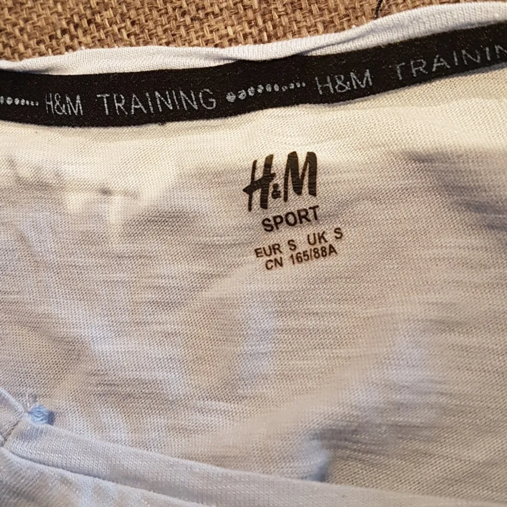 Blue, front tie workout top from H&M. Worn it once or twice.. Hoodies.