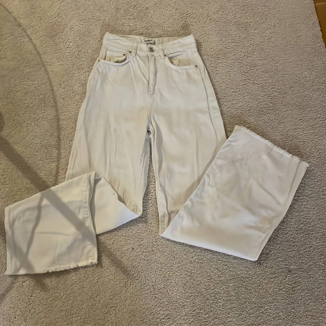 Vita högmidjade jeans