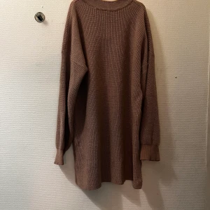 Rosa Halströja  - Rosa, glittrig halströja 