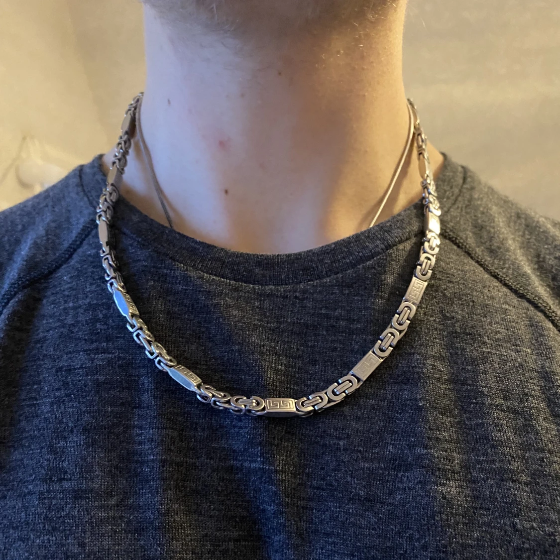 Länk i rostfritt stål