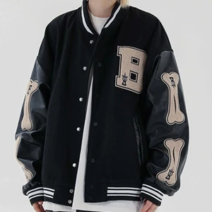 Varsity Jacket - M - This Varsity jacket has no damage, and it is very trendy! The color is black and beige, and the arms are made out of a leather material. The size is M. 