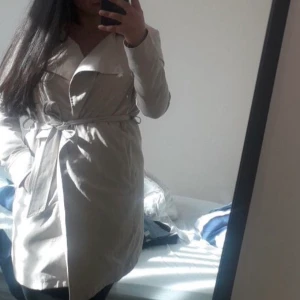 Kappa  - Beige kappa knappt använd.