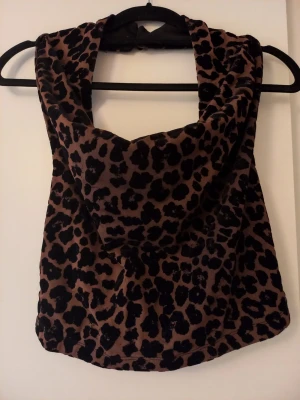 Topp  - Fest topp med öppen rygg