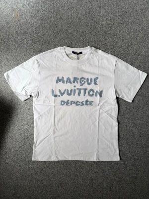 lLV White T shirt - Size M, true to size. Unused, brand new and fresh. Please feel free to ask questions.