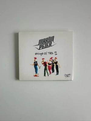 CD : Martin Peter - Enough of This?! - CD-album med Martin Peter, "Enough Of This?!". Skivan innehåller 17 låtar, inklusive "Intro (Gay On Possession)", "Psychoville" och "Rise Up". Utgiven av Angora Steel. Mycket gott skick!!  (Skickas helst, men kan även hämtas i Stockholm vid behov)
