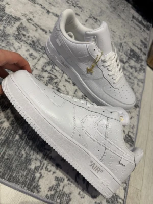 Nike x LV white shoes - Size 45, true to size. Brand new and never worn, very comfortable and great quality.