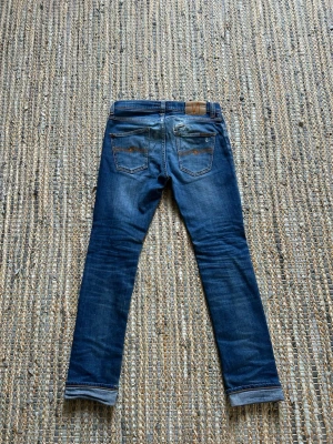 Nudie Jeans | Grim Tim - Nudie Grim Tim. W28 L32, pris kan diskuteras