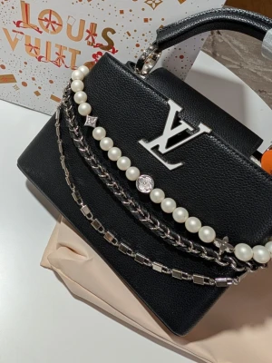 Iouis Vuitton handväska  - Behöver man ens beskriva den? Det enda jag kan säga är: wow!