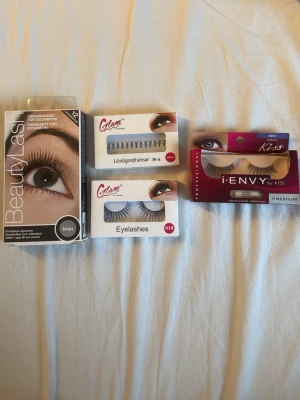 Ögonbryn färg, fransar - Paket med BeautyLash ögonfransfärg i brun, Glam lösögonfransar och fransknippen samt Kiss i-ENVY lösögonfransar. Perfekt för att framhäva ögonfransarna med både färg och volym. Flera olika stilar och former, allt i originalförpackning. Säljer allt för 100kr