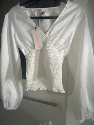 Smock blus  - Prislapp kvar, storlek xxs. Gina 14+ 