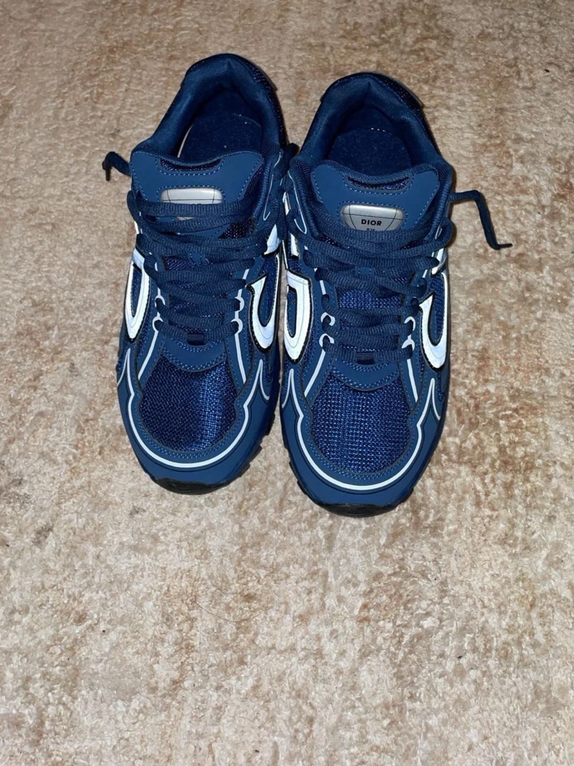 Blå Dior sneakers med vita detaljer