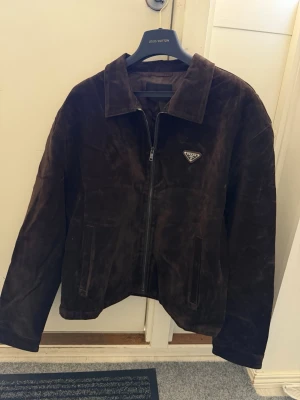 Prada dark brown jacket - Size M, true to size. Very comfortable and fits nicely. Brand new