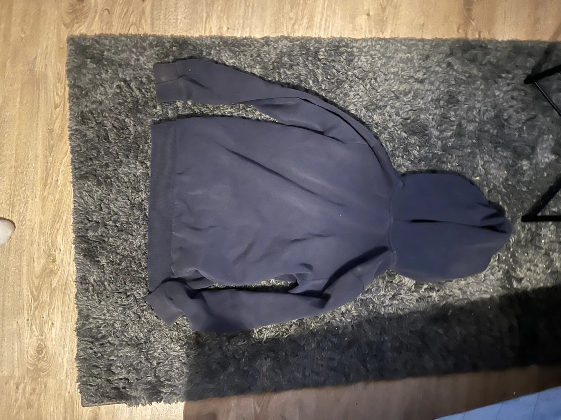 Mörkblå hoodie Peak Performance - 1