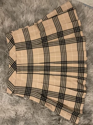 Beige pleated skirt - Super cute beige pleated skirt! Waist is 35 cm, length is 41cm, I used to love wearing it but changed styles 🤍🤍