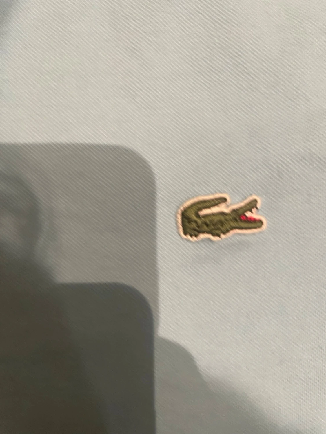 Ljusblå piké från Lacoste - 1