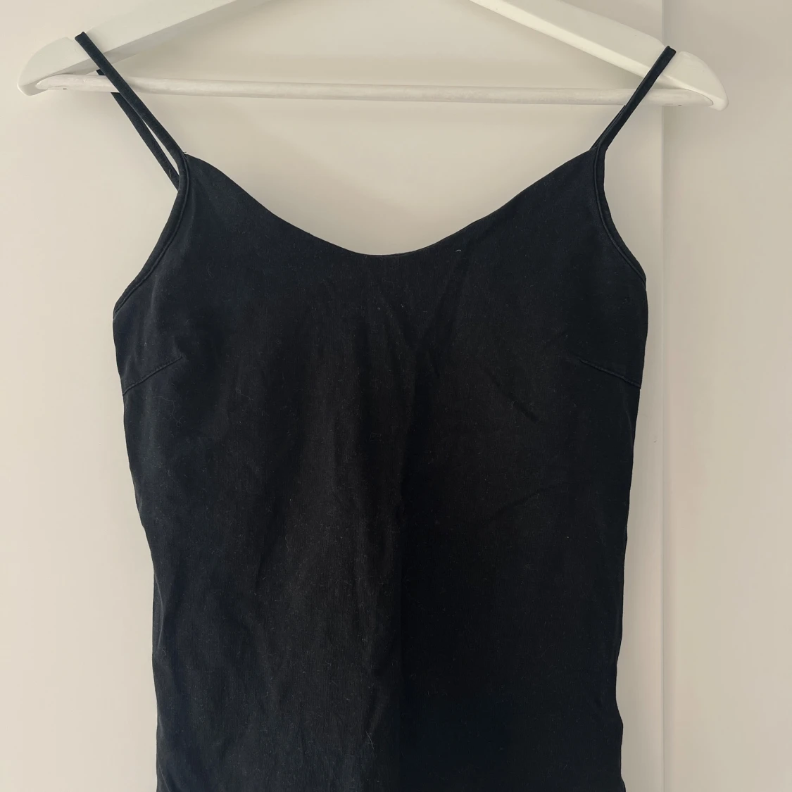 Linne med justerbara axelband