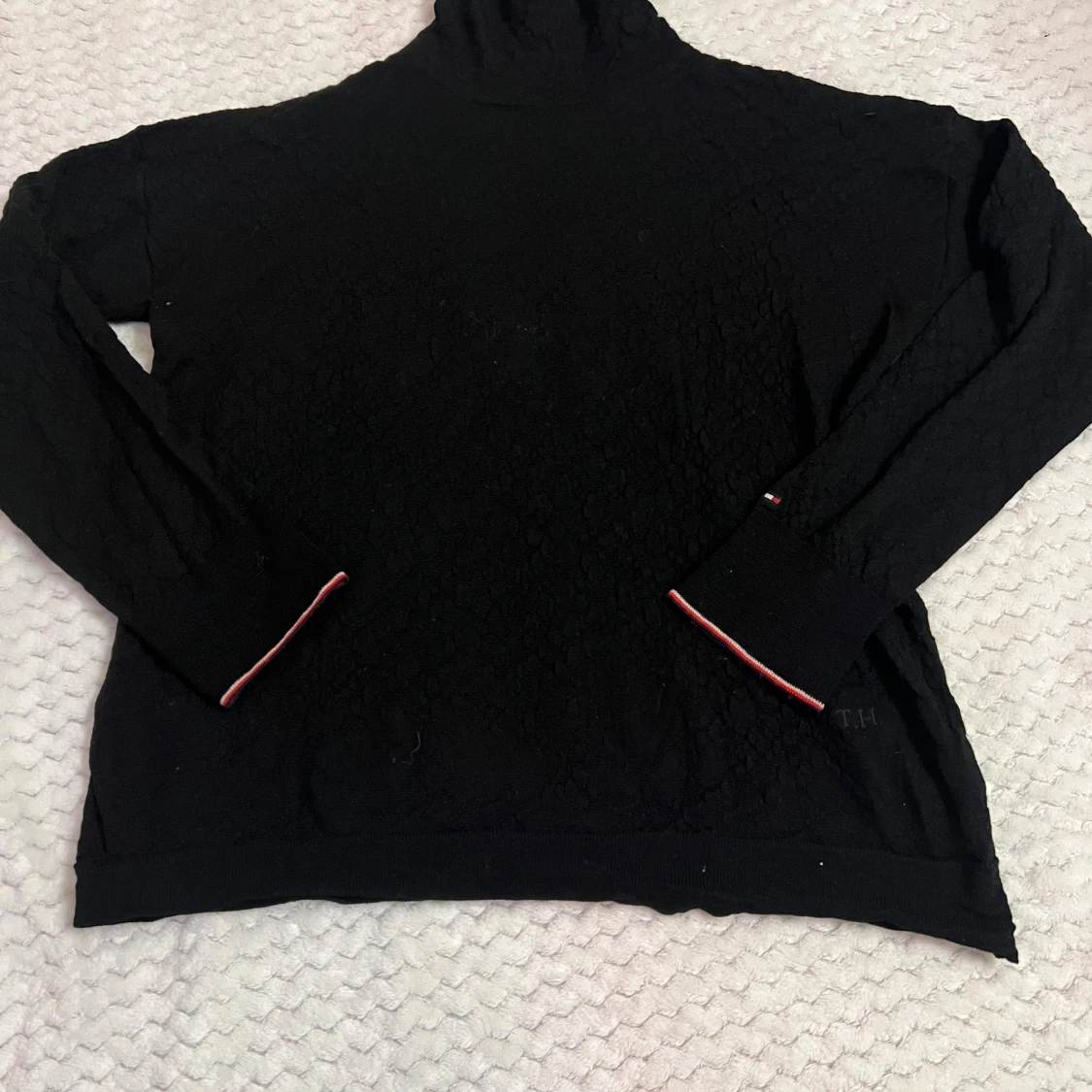 Svart polotröja från Tommy Hilfiger