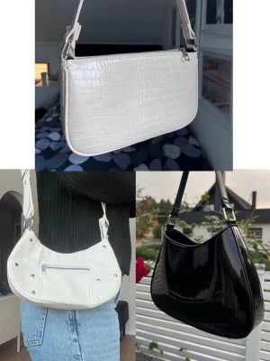 Tre trendiga väskor i olika stilar och färger - Säljer tre snygga handväskor: en beige croco-mönstrad axelväska, en vit axelremsväska med dragkedja och silverdetaljer samt en svart glansig axelväska. Perfekta accessoarer för att lyfta din outfit. Fler bilder finns! Fråga gärna vid funderingar kring mått osv :)