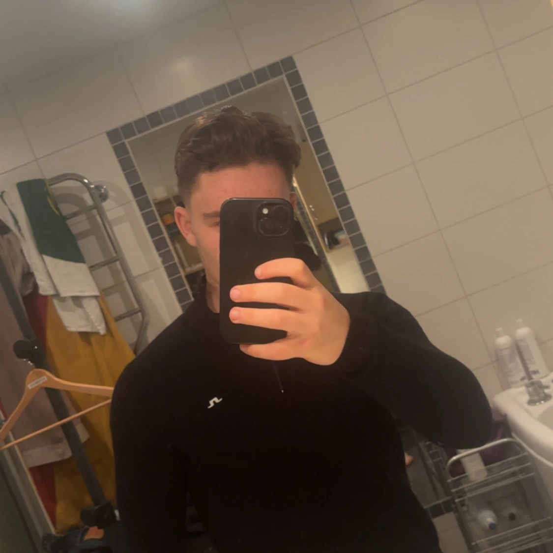 Svart stickad half zip från J.Lindeberg