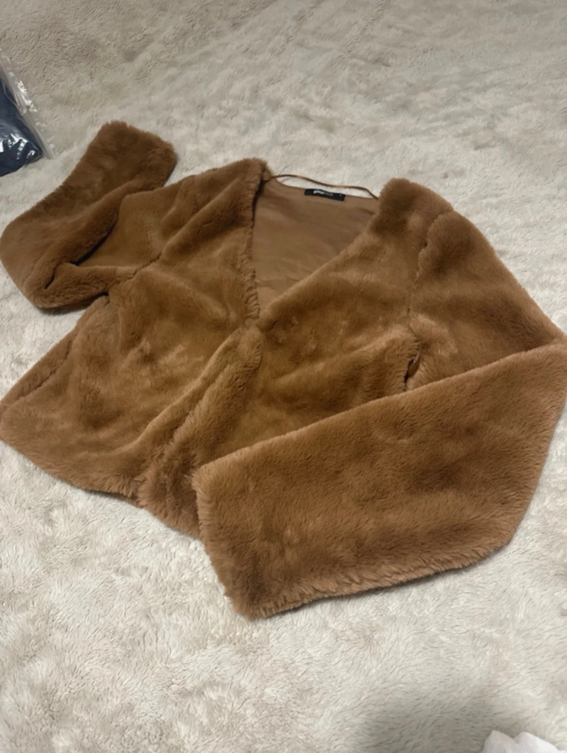 Brun pälsjacka från Gina Tricot