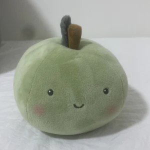 Gossedjur  - Ingen elektronikprodukt identifierad på bilderna. Bilderna visar en grön plyschleksak formad som ett äpple med ett sött ansikte, men inga synliga elektroniska komponenter, funktioner eller märken relaterade till elektronik.