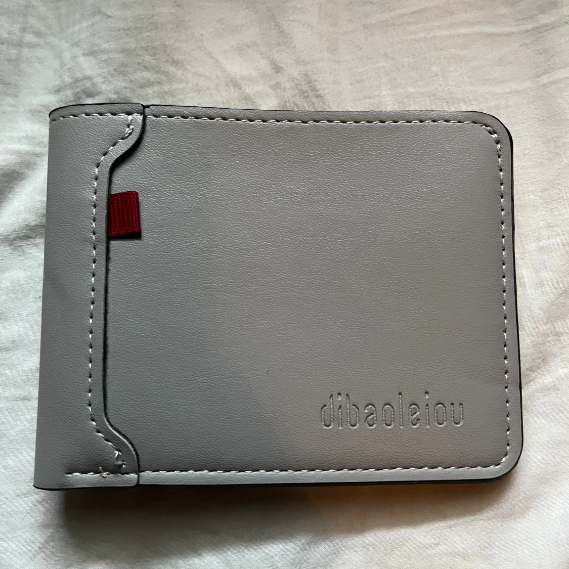 Grå plånbok från dibaoleiou i skinn