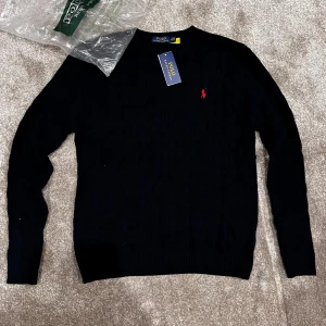 Navy blue cable knit Polo Ralph Lauren - Nice navy blue polo ralph lauren cable knit. I always ship on a same day as purchase. Price is negiotable