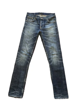 Nudie Jeans Selvedge  - Selvedge Nudie Jeans i mycket bra skick. Modellen heter Grim Tim. Lagning vilket knappast syns från utsidan (se sista bilden)