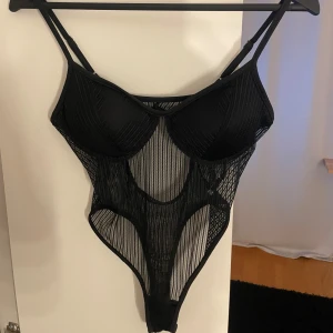  En svart body   - En fin body men aldrig använt 