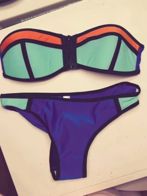 TRIANGL bikini - Super populär 2016 bikini💗💗💗snygg bandeau bikini med turkos och orange överdel samt blå och turkos underdel. Bikinin har svarta kontrastkanter. 