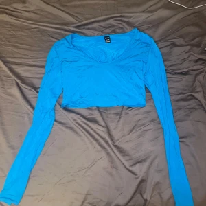 Blå tröja - Blå magtröja använd en gång 