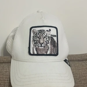 Goorin Bros Vit tiger keps. - En fin Goorin Bros keps. Helt original och köpt från Johnells.