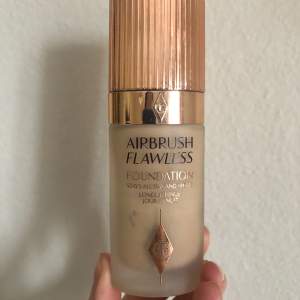 Charlotte Tillbury Airbrush Flawless Foundation shade 5.5.  Full coverage foundation, almost entire bottle left, the shade is way too dark for me.