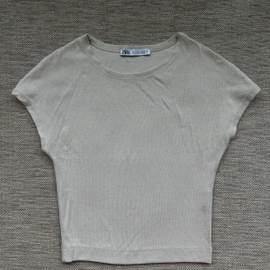 A crop top - A crop top in a natural color that matches all other colors. New without tags