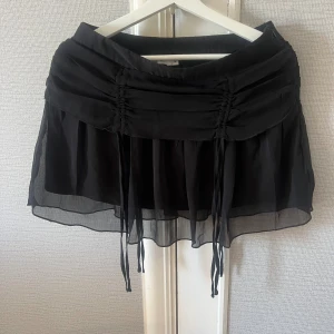 Kort kjol från NAKD - Strl 36 