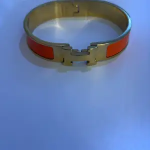 Orange/guld hermes armband 