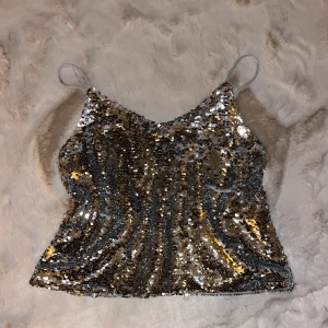 Paljettlinne  - Helt nytt. Alla paljetter hela och fina. Passar xs-s. 