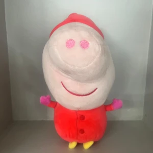 Gratis gris plushie - Greta gris plushie.