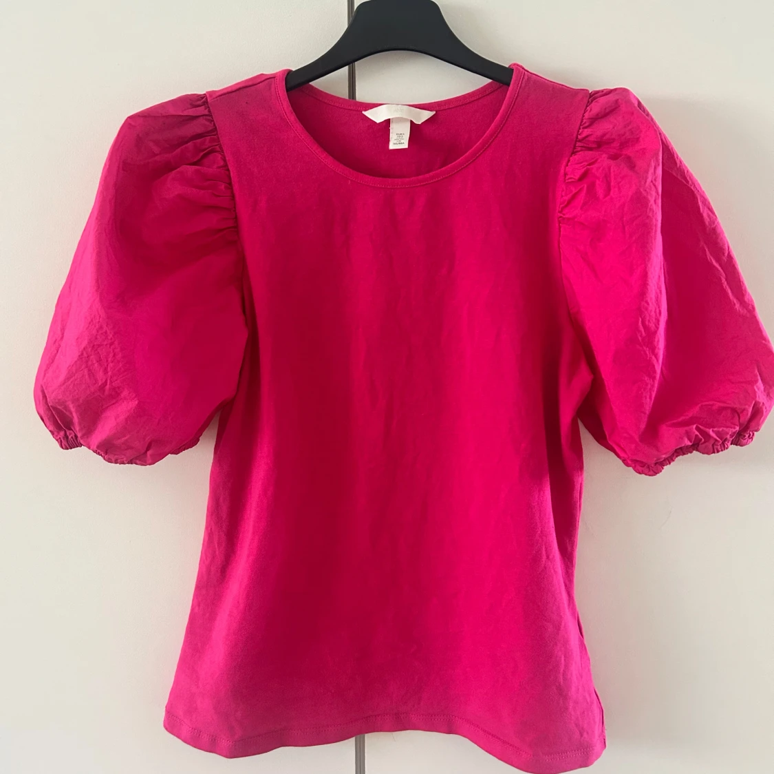 Rosa topp med puffärmar från H&M