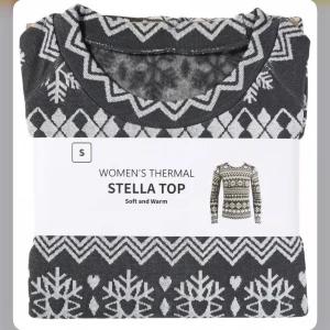 Svart och vit termotröja från Stella - Säljer en mysig och varm termotröja från Stella i svart och vitt. Tröjan har ett snyggt mönster med hjärtan och snöflingor, perfekt för kyliga dagar. Den är långärmad och gjord för att hålla dig varm och bekväm.