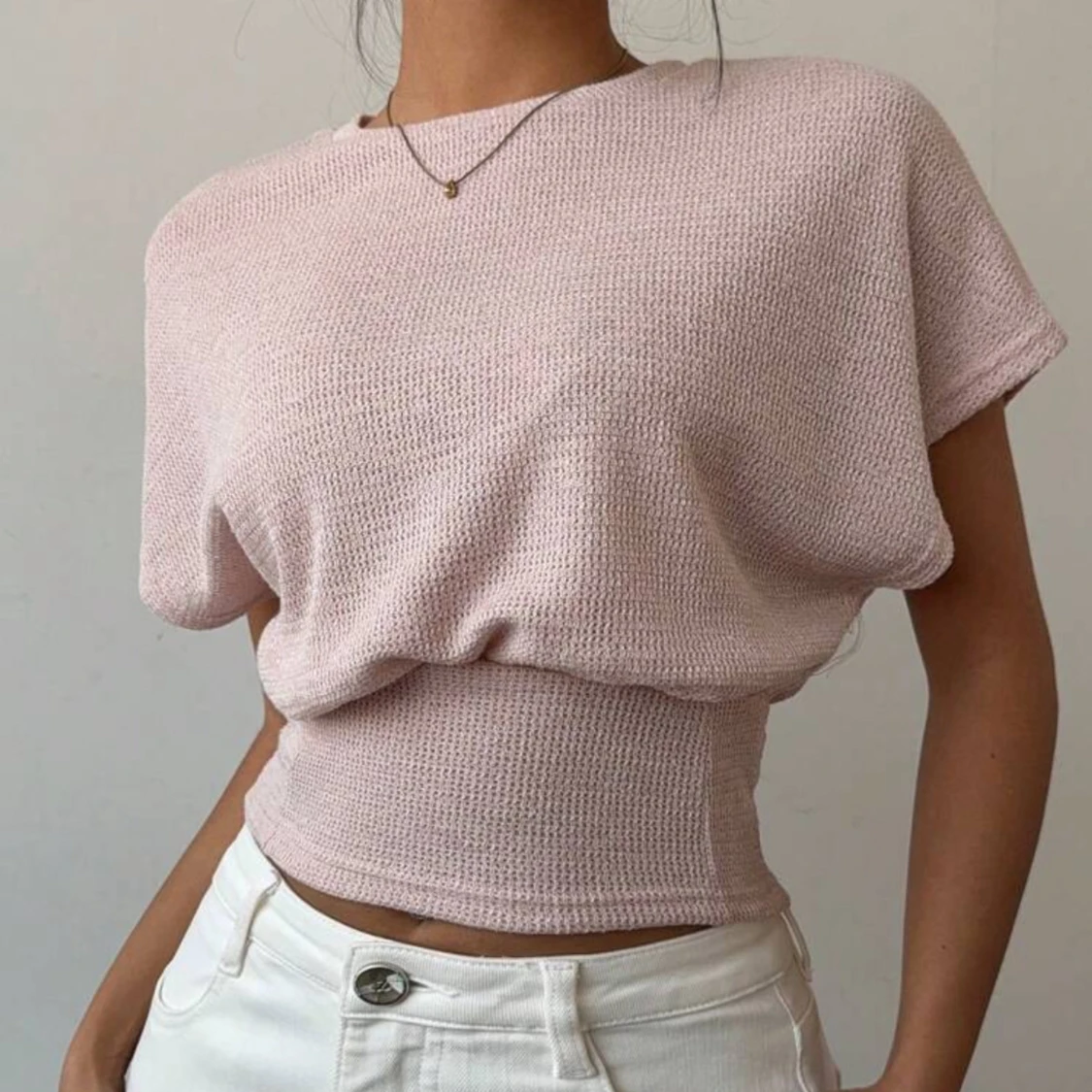 Ljusrosa stickad croppad topp