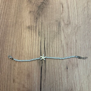 Armband med sjöstjärna och pärlor - Superfint armband med sjöstjärna och pärlor🐚💘